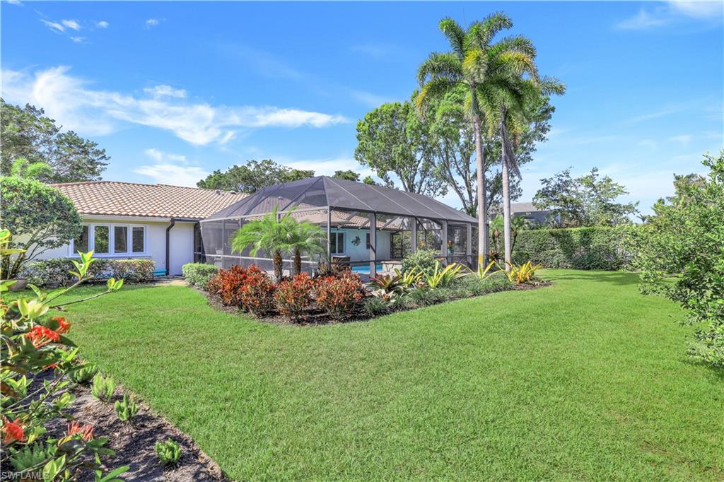635 Anchor Rode Drive Naples, FL 34103 - Photo 39 of 50 a view of a house with backyard and garden