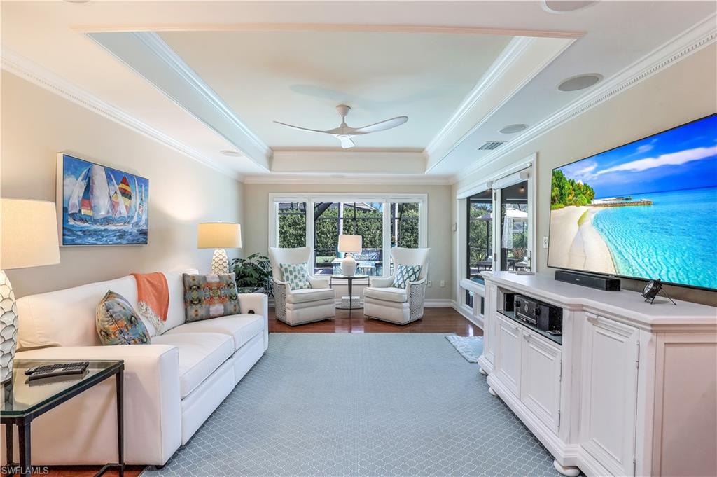 635 Anchor Rode Drive Naples, FL 34103 - Photo 5 of 50 a living room with furniture and a flat screen tv
