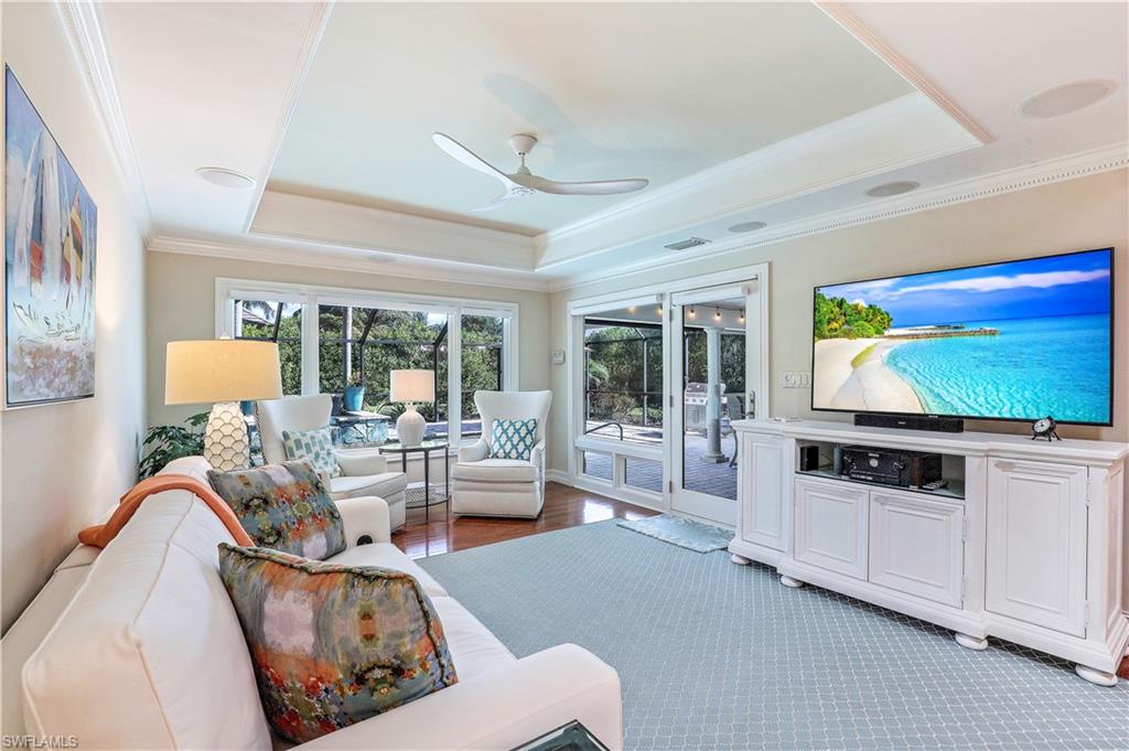 635 Anchor Rode Drive Naples, FL 34103 - Photo 6 of 50 a living room with furniture and a flat screen tv