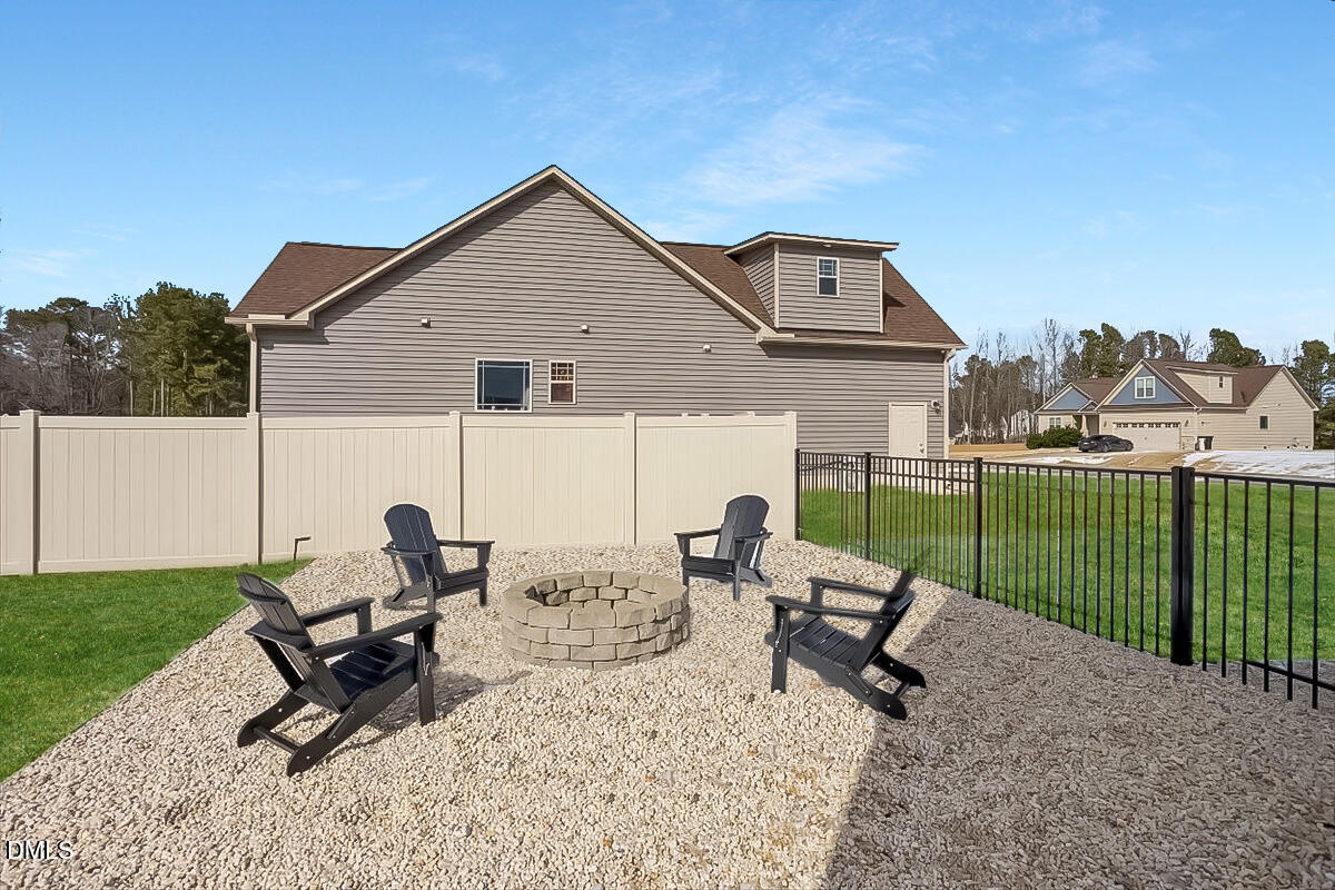 68 Bodacious Lane Benson, NC 27504 - Photo 6 of 39 a view of a backyard with sitting area and furniture