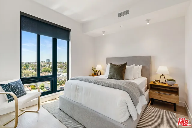 a bathroom with two sink and mirror