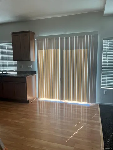 a view of a living room with furniture and a window