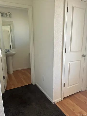 a view of front door with wooden floor