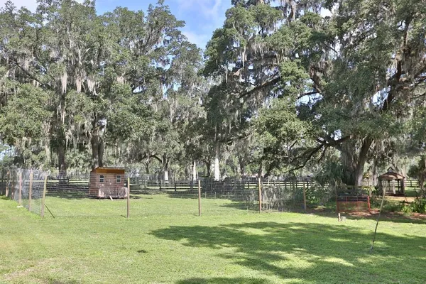 a view of a garden with a lake view