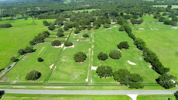 a kitchen with stainless steel appliances granite countertop a refrigerator sink and stove