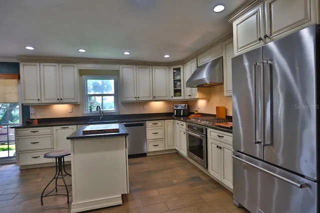 a view of a garden with swimming pool and green space