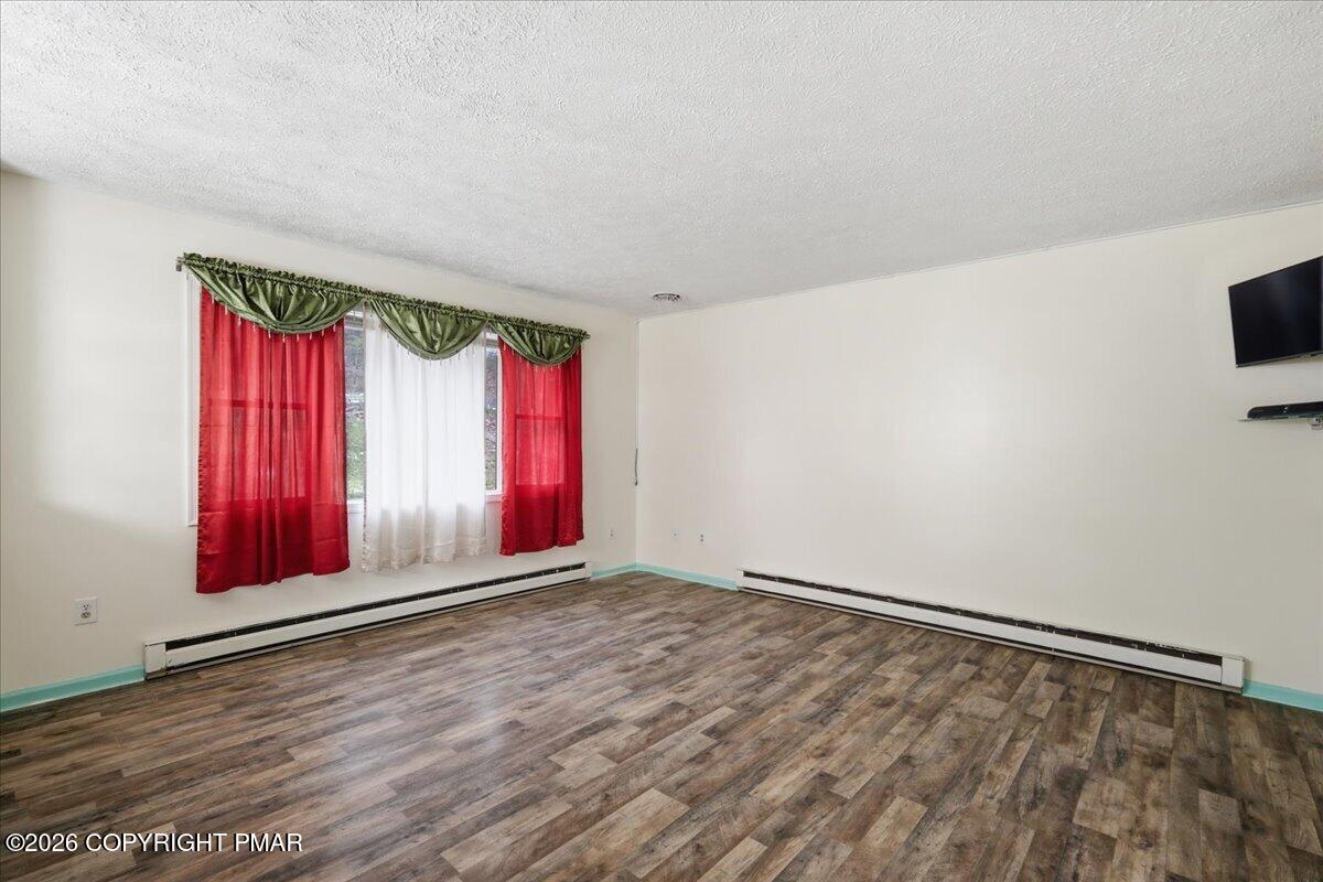 606 Rimrock Road Bartonsville, PA 18321 - Photo 11 of 36 an empty room with windows