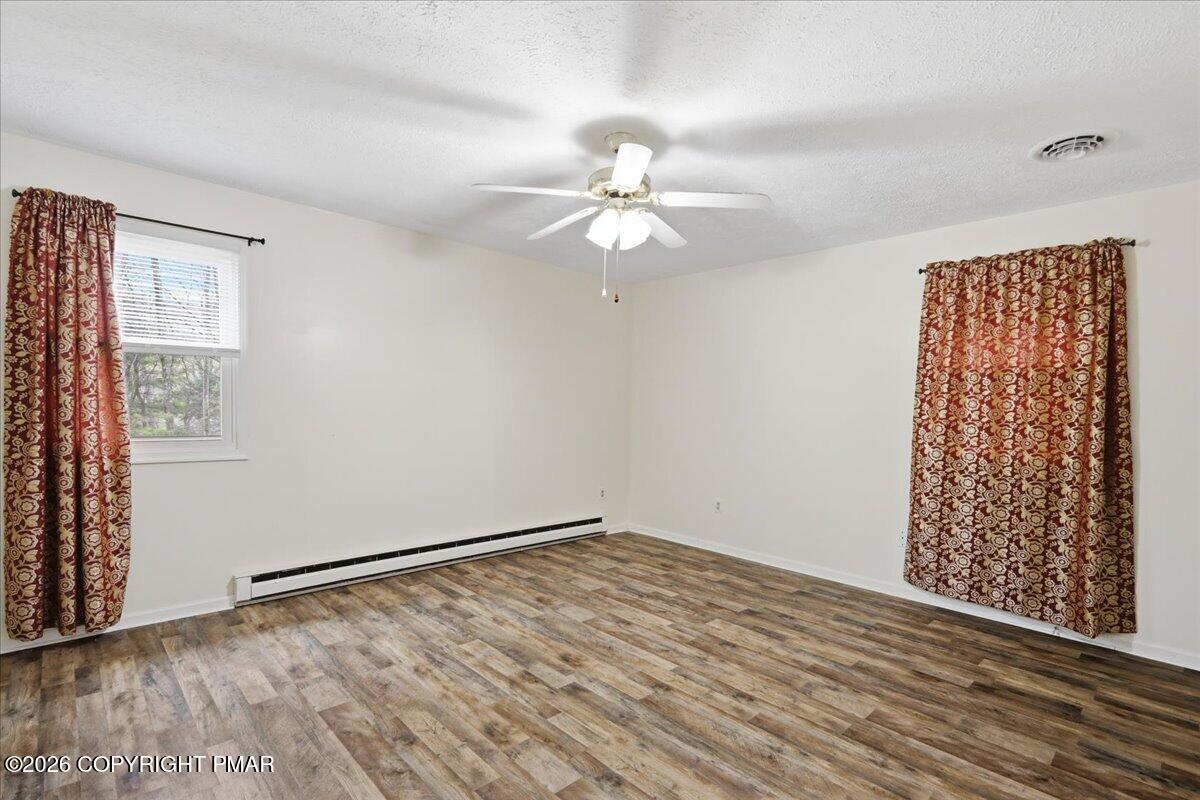 606 Rimrock Road Bartonsville, PA 18321 - Photo 16 of 36 wooden floor in an empty room with a window