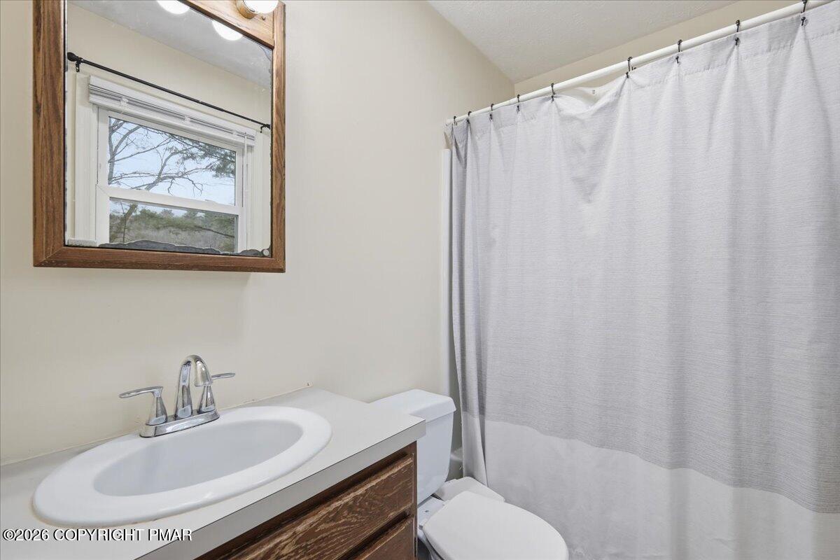 606 Rimrock Road Bartonsville, PA 18321 - Photo 18 of 36 a bathroom with a sink and a mirror