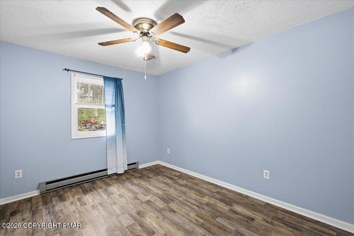 606 Rimrock Road Bartonsville, PA 18321 - Photo 19 of 36 an empty room with a window and a fan