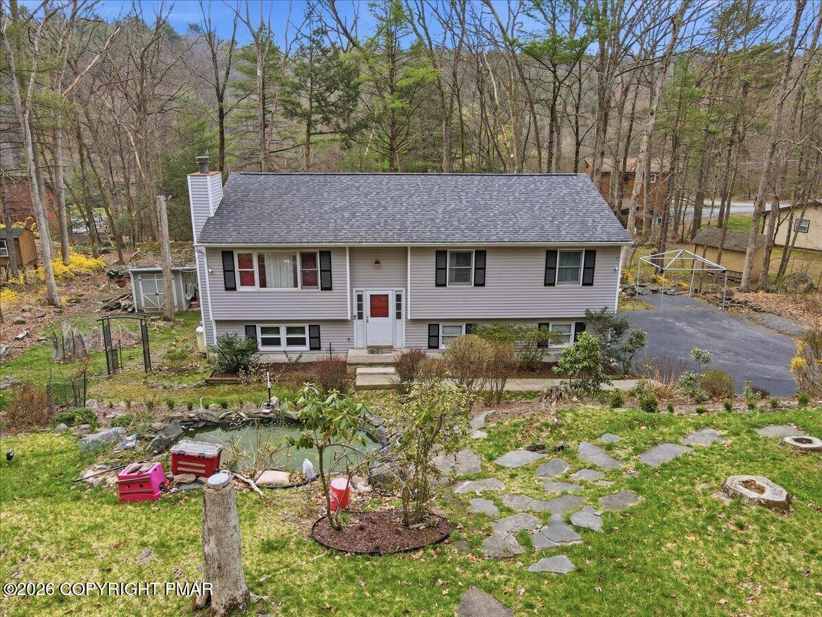 606 Rimrock Road Bartonsville, PA 18321 - Photo 2 of 36 a house view with a outdoor space