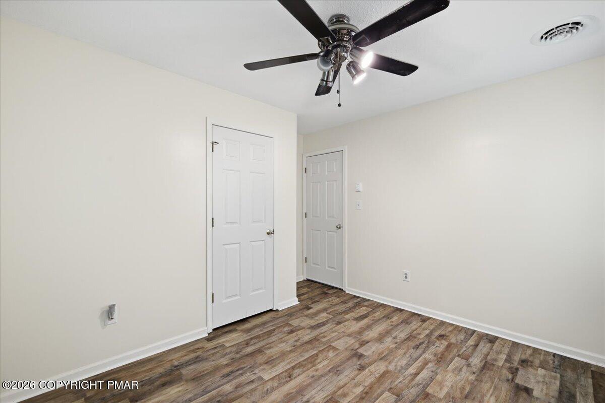 606 Rimrock Road Bartonsville, PA 18321 - Photo 22 of 36 wooden floor in an empty room