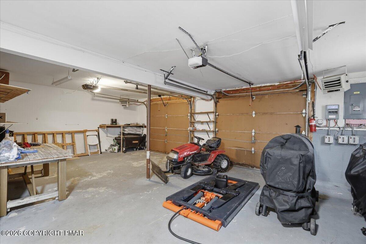 606 Rimrock Road Bartonsville, PA 18321 - Photo 25 of 36 a room with gym equipment and a mirror