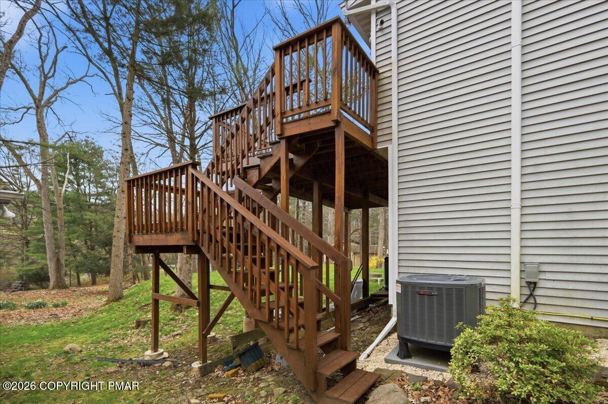 606 Rimrock Road Bartonsville, PA 18321 - Photo 27 of 36 a view of a house with a small yard and deck