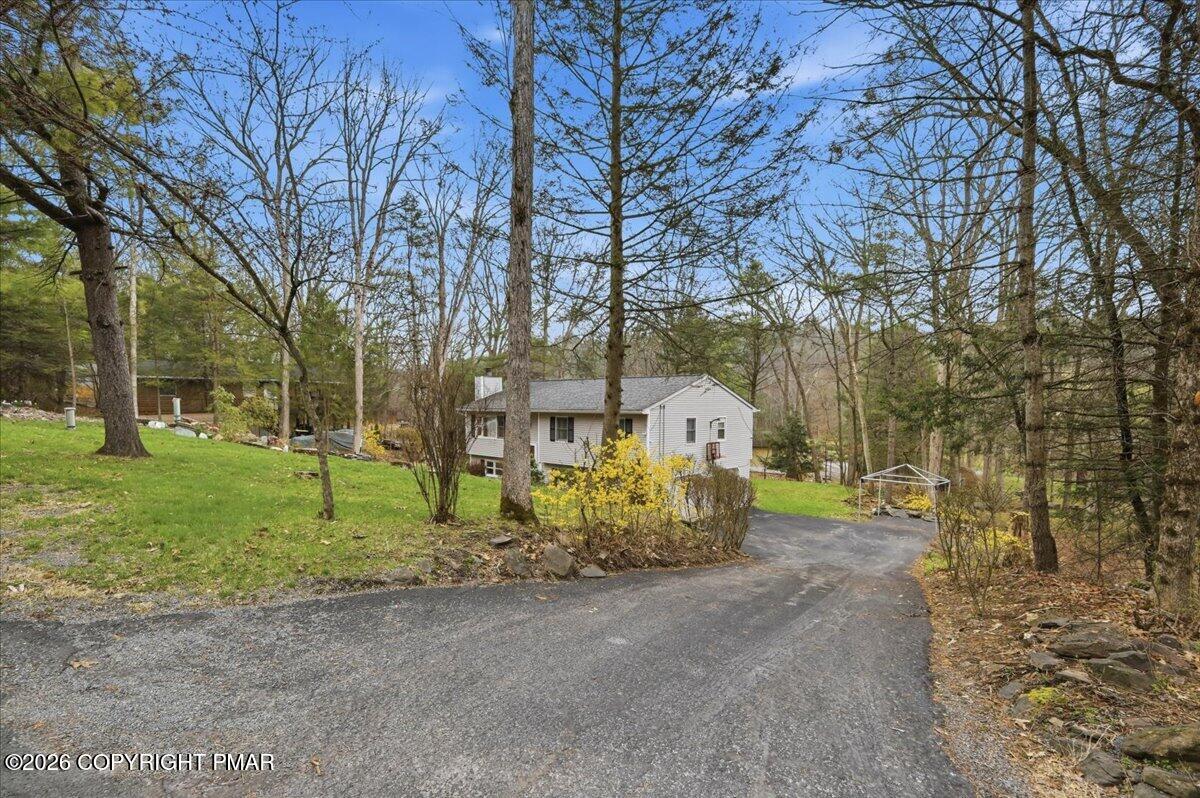 606 Rimrock Road Bartonsville, PA 18321 - Photo 3 of 36 a view of road and trees