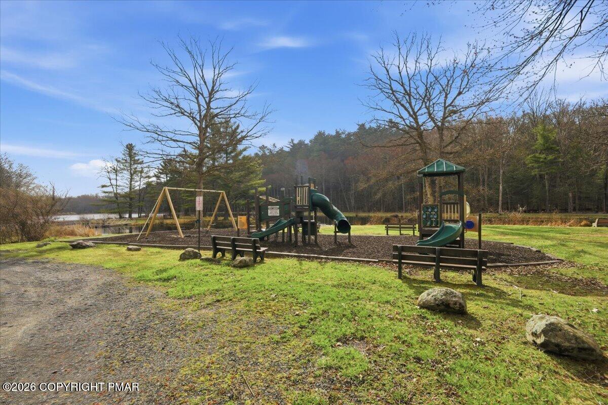 606 Rimrock Road Bartonsville, PA 18321 - Photo 35 of 36 a swimming pool with outdoor seating and yard