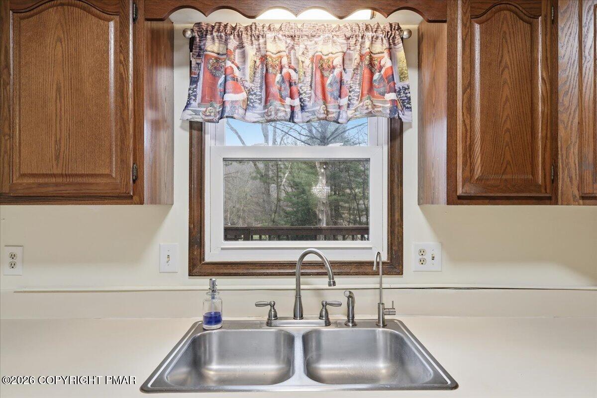 606 Rimrock Road Bartonsville, PA 18321 - Photo 8 of 36 a bathroom with a sink and a large mirror