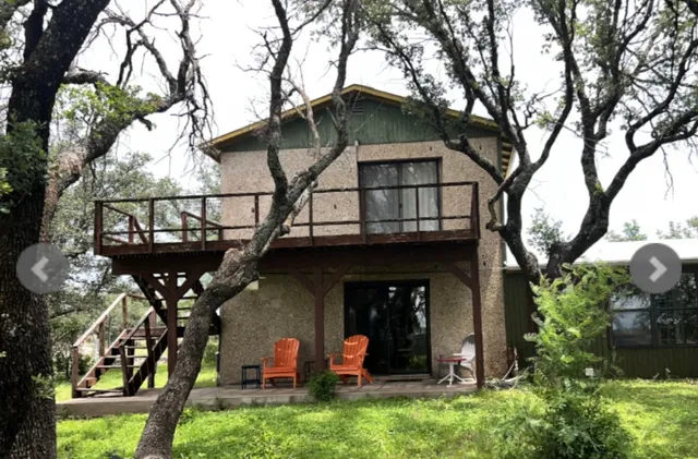 a view of a dining room with furniture and window