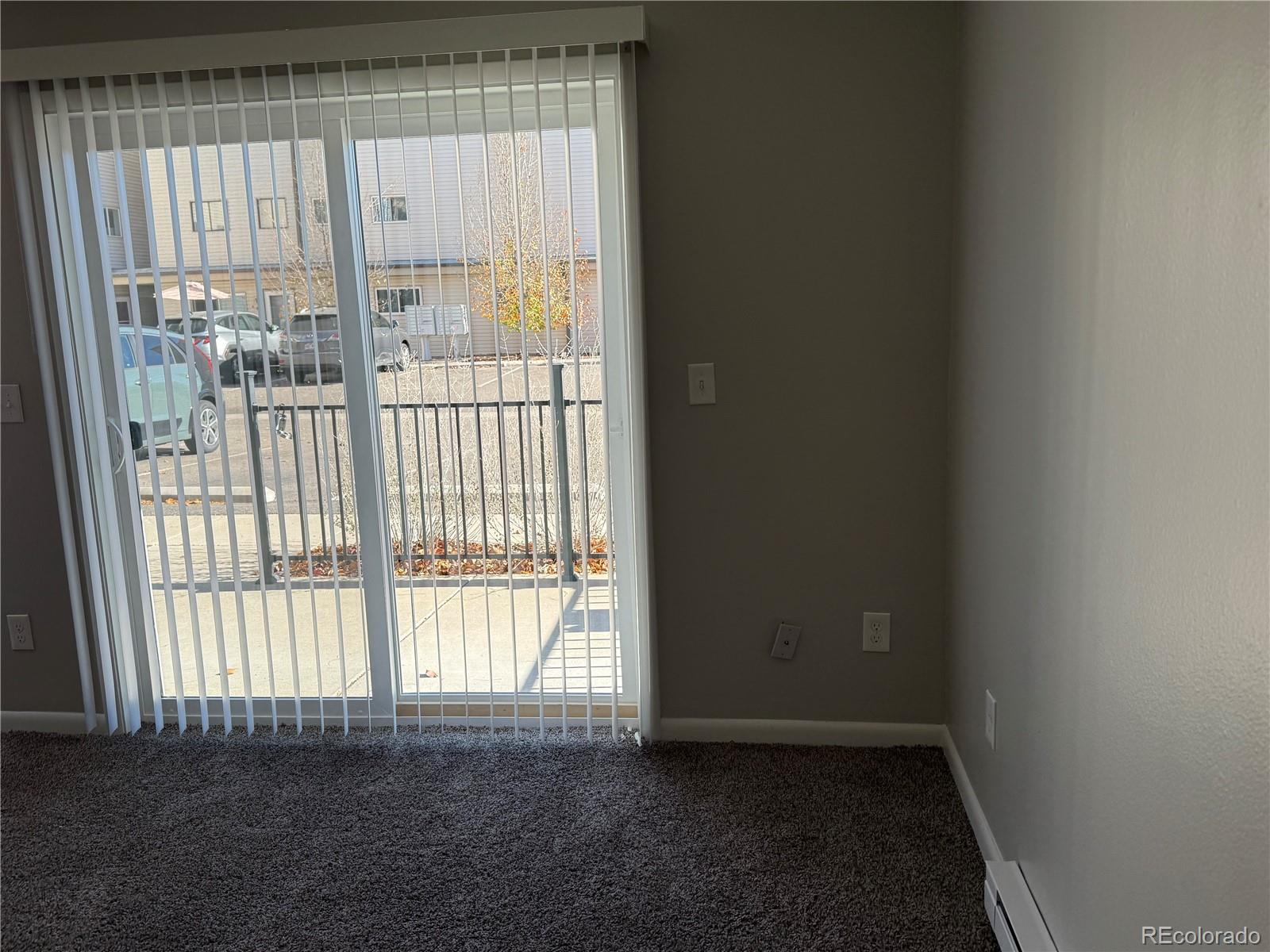 6021 Yarrow Street, Unit C23 Arvada, CO 80004 - Photo 3 of 6 a view of an empty room with a window