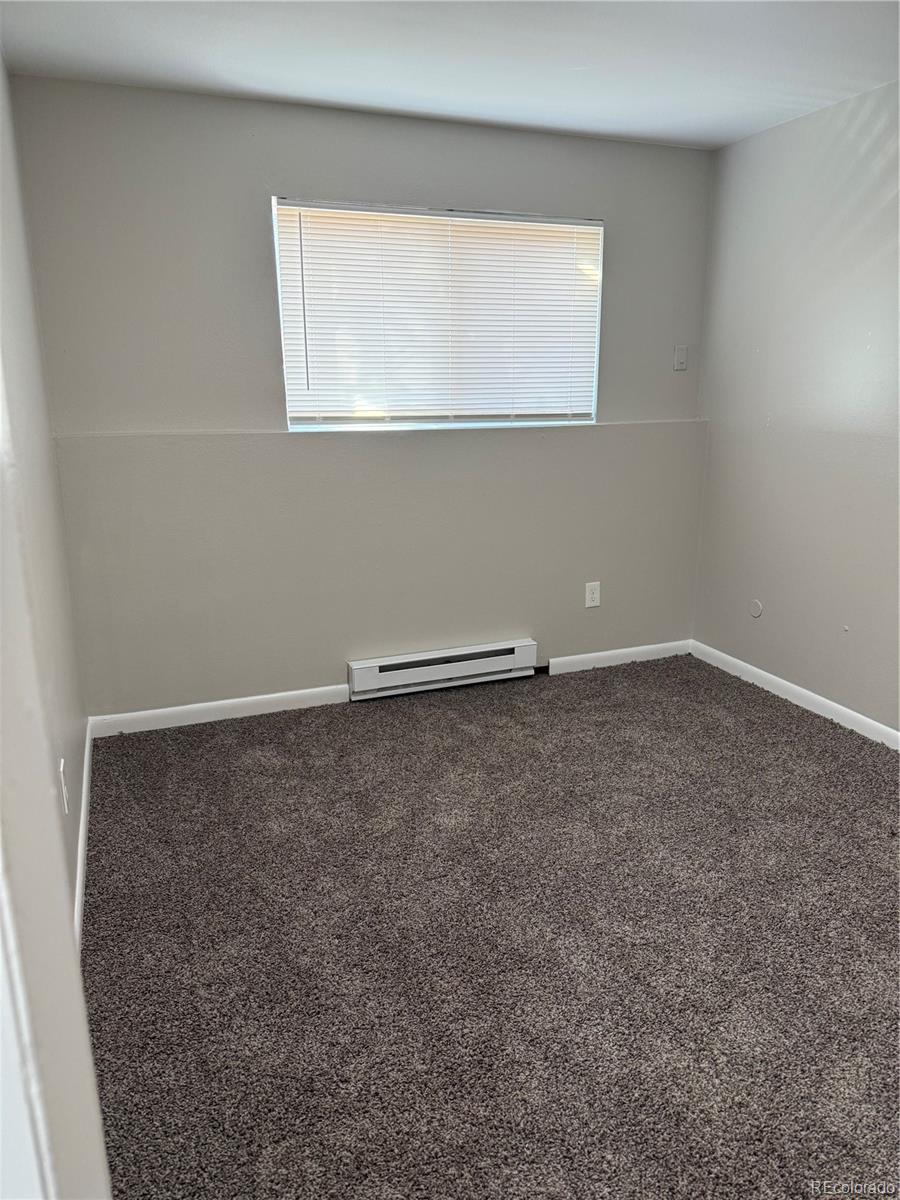6021 Yarrow Street, Unit C23 Arvada, CO 80004 - Photo 4 of 6 an empty room with a window