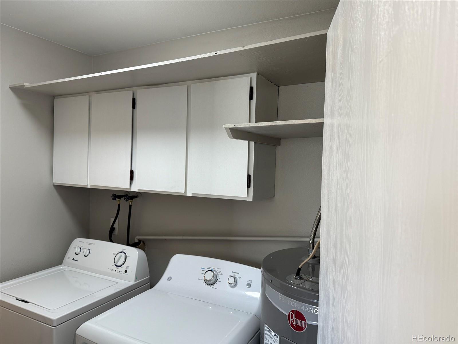 6021 Yarrow Street, Unit C23 Arvada, CO 80004 - Photo 5 of 6 a utility room with dryer and washer