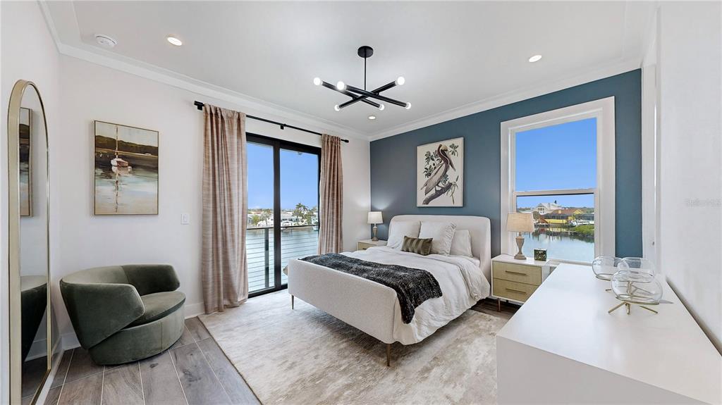 777 Gran Kaymen Way Apollo Beach, FL 33572 - Photo 17 of 30 a spacious bedroom with a bed couch and window