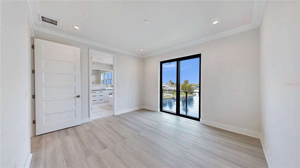 777 Gran Kaymen Way Apollo Beach, FL 33572 - Photo 9 of 30 wooden floor in an empty room with a window
