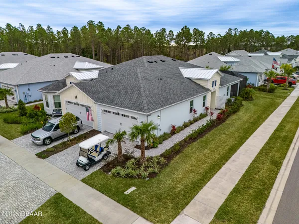 an aerial view of a house with a garden