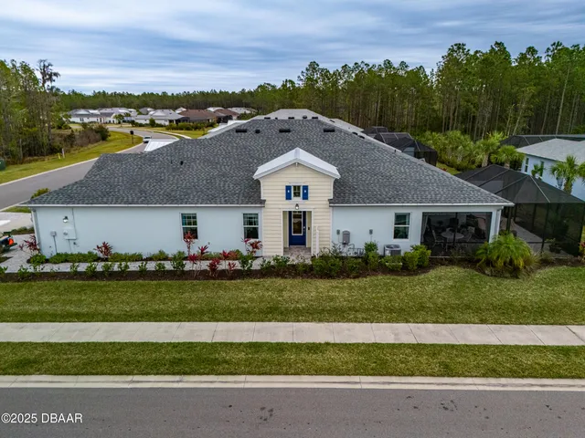 an aerial view of a house with a garden