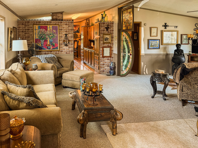 38569 North Sheridan Road, Unit 390 Beach Park, IL 60099 - Photo 16 of 28 a living room with furniture gym equipment and a large window