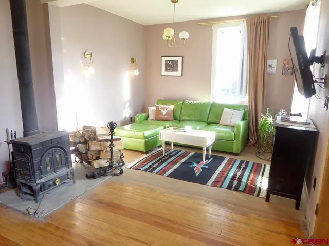 a living room with furniture fireplace and a flat screen tv