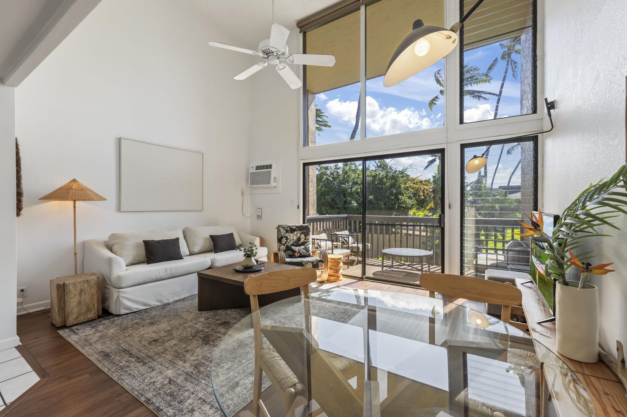 a living room with furniture or couch and a large window