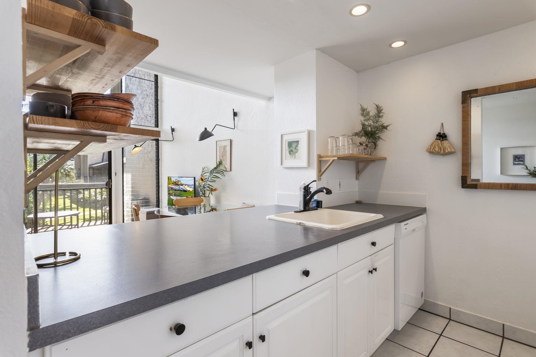 1299 Uluniu Road, Unit G202 Kihei, HI 96753 - Photo 12 of 46 a view living room with a sink and chandelier