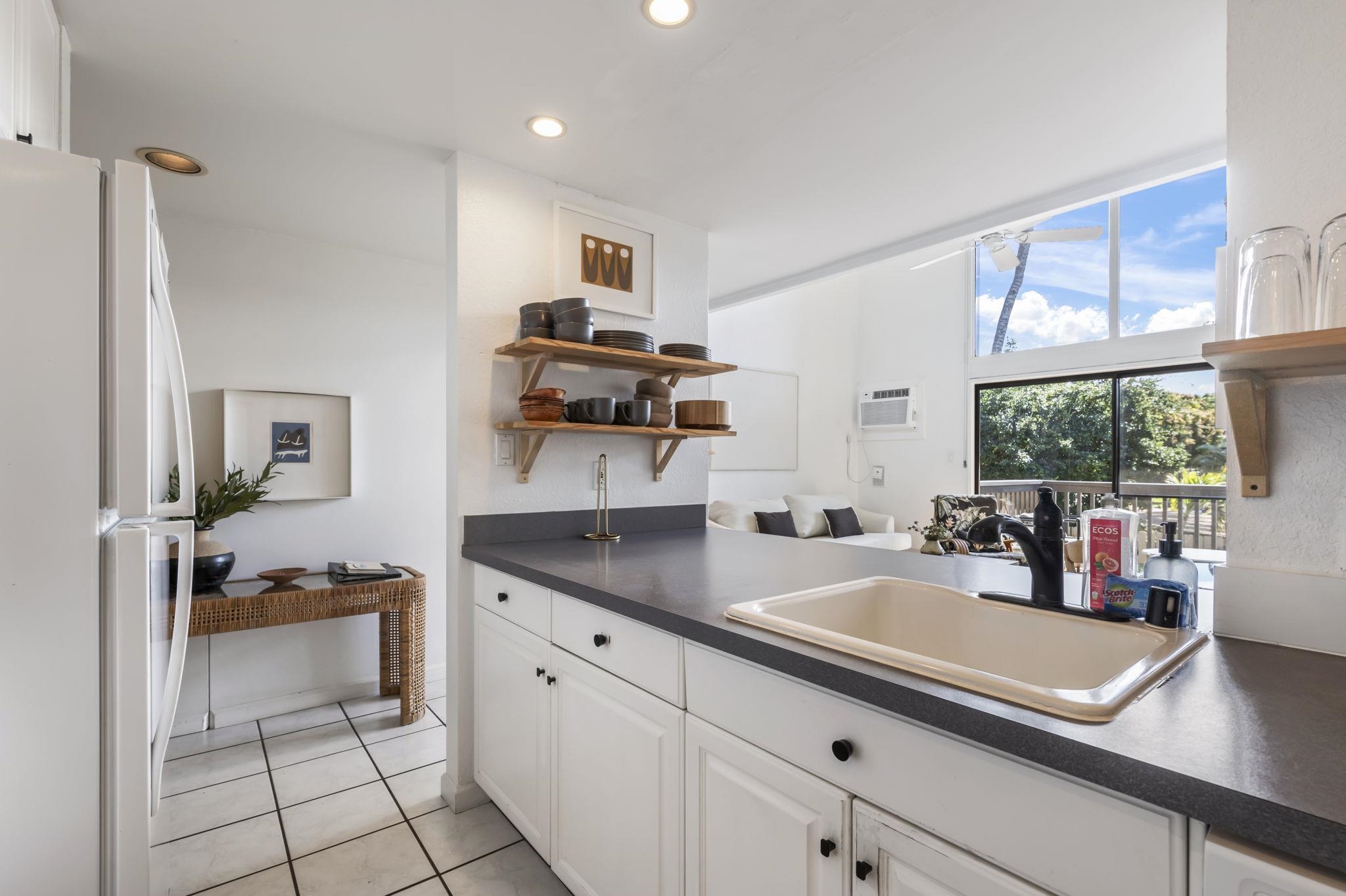 1299 Uluniu Road, Unit G202 Kihei, HI 96753 - Photo 15 of 46 a kitchen with a sink appliances and cabinets