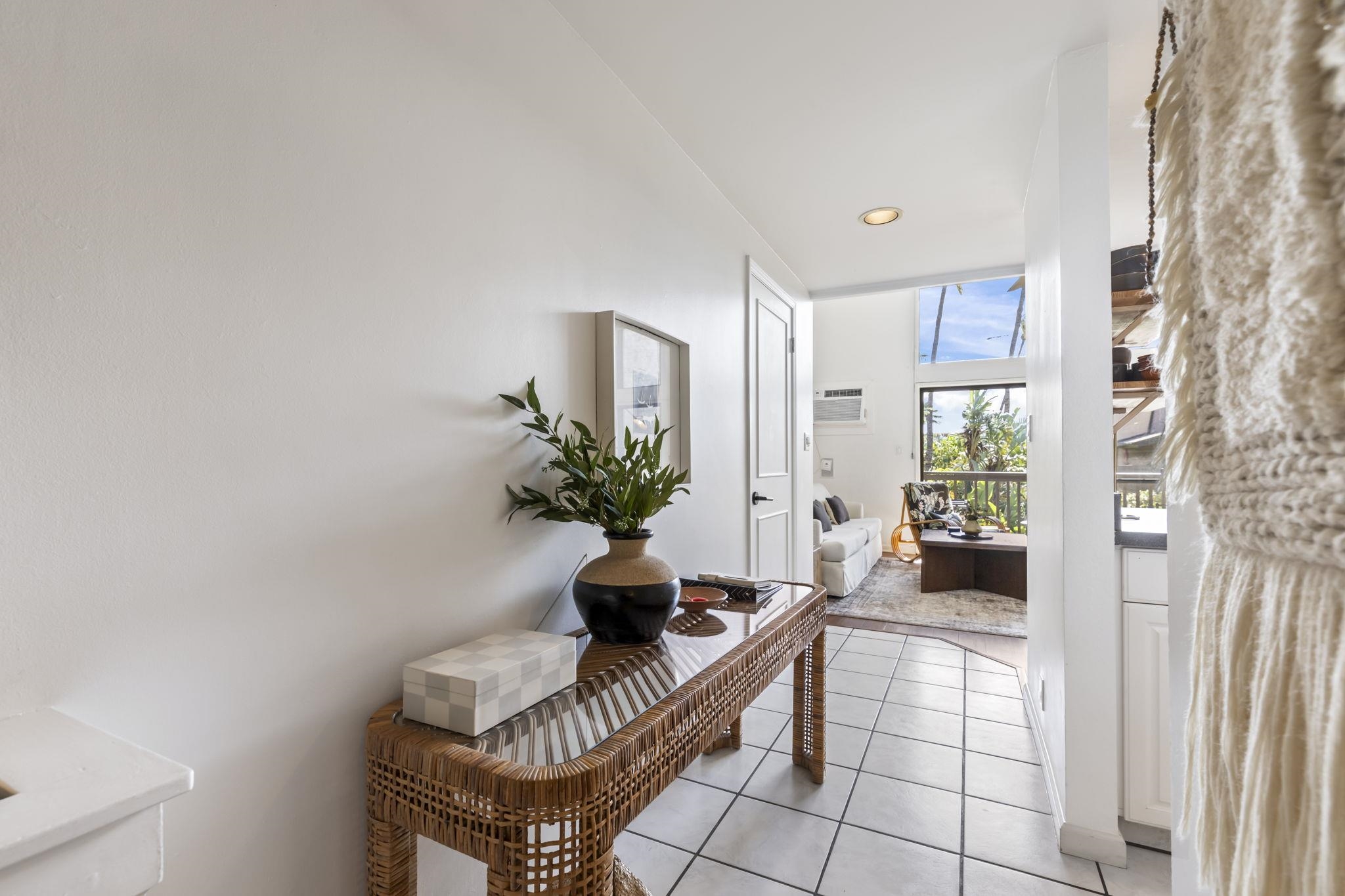 1299 Uluniu Road, Unit G202 Kihei, HI 96753 - Photo 18 of 46 a living room with furniture and a potted plant