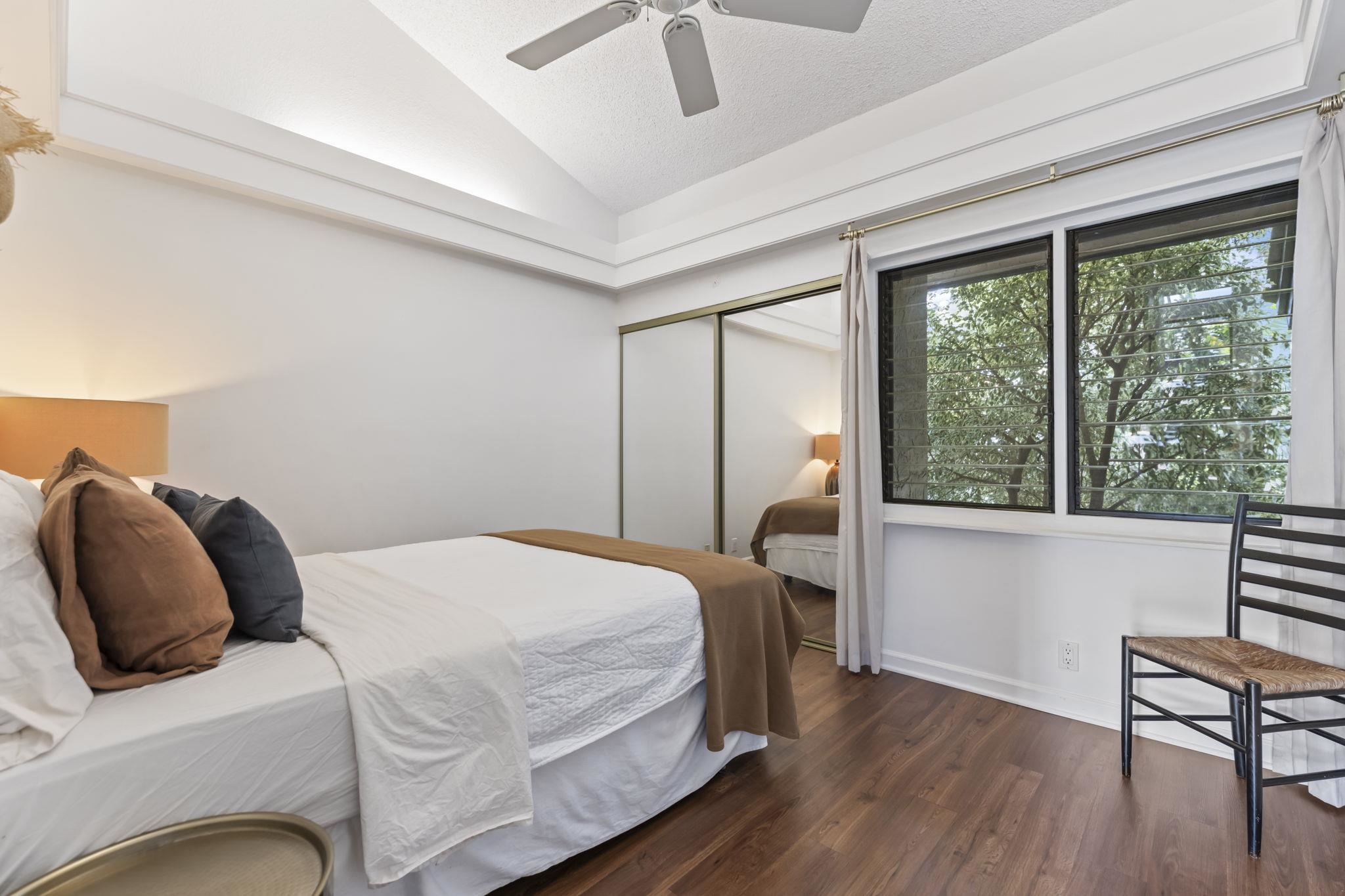 1299 Uluniu Road, Unit G202 Kihei, HI 96753 - Photo 21 of 46 a bedroom with a bed and a window