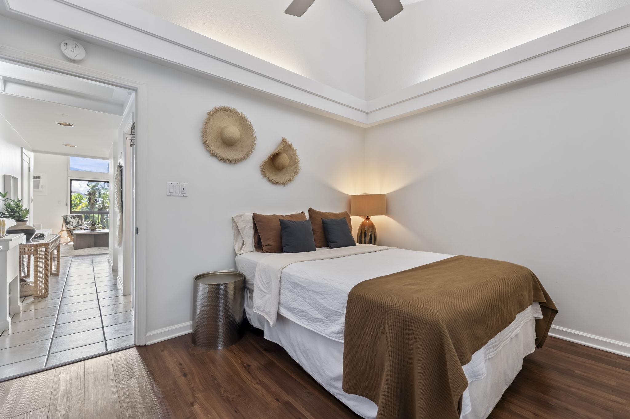 1299 Uluniu Road, Unit G202 Kihei, HI 96753 - Photo 22 of 46 a bedroom with bed and a window