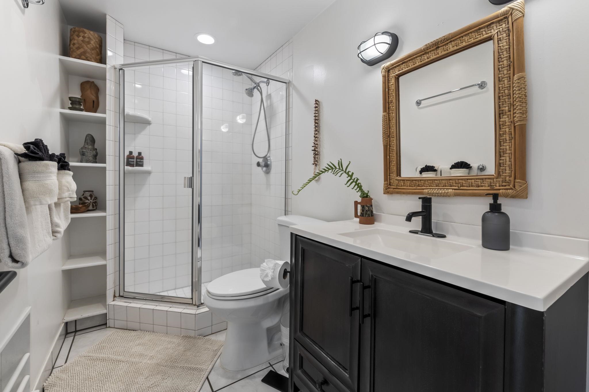 1299 Uluniu Road, Unit G202 Kihei, HI 96753 - Photo 23 of 46 a bathroom with a sink a toilet and shower