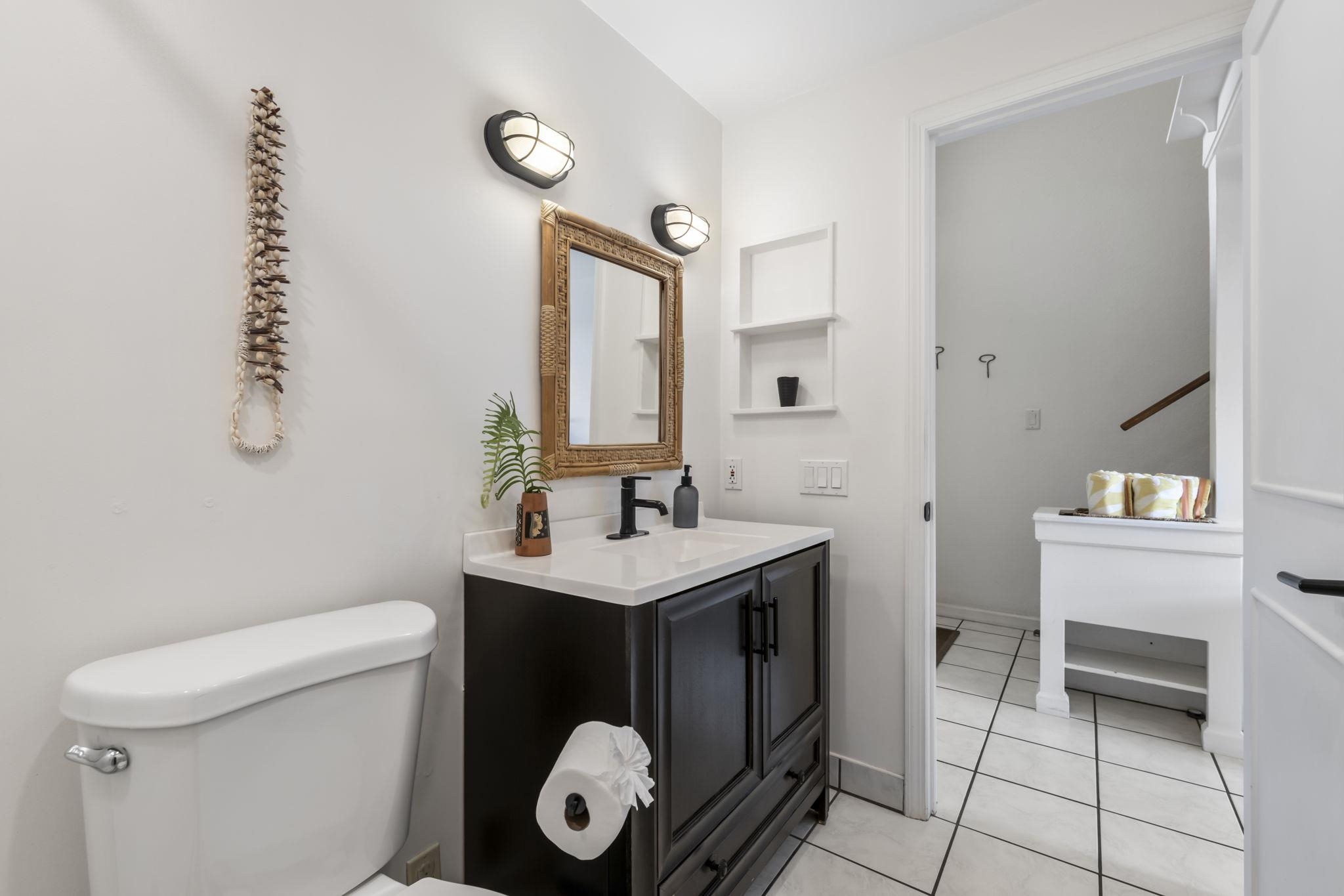 1299 Uluniu Road, Unit G202 Kihei, HI 96753 - Photo 25 of 46 a bathroom with a sink a toilet and a mirror