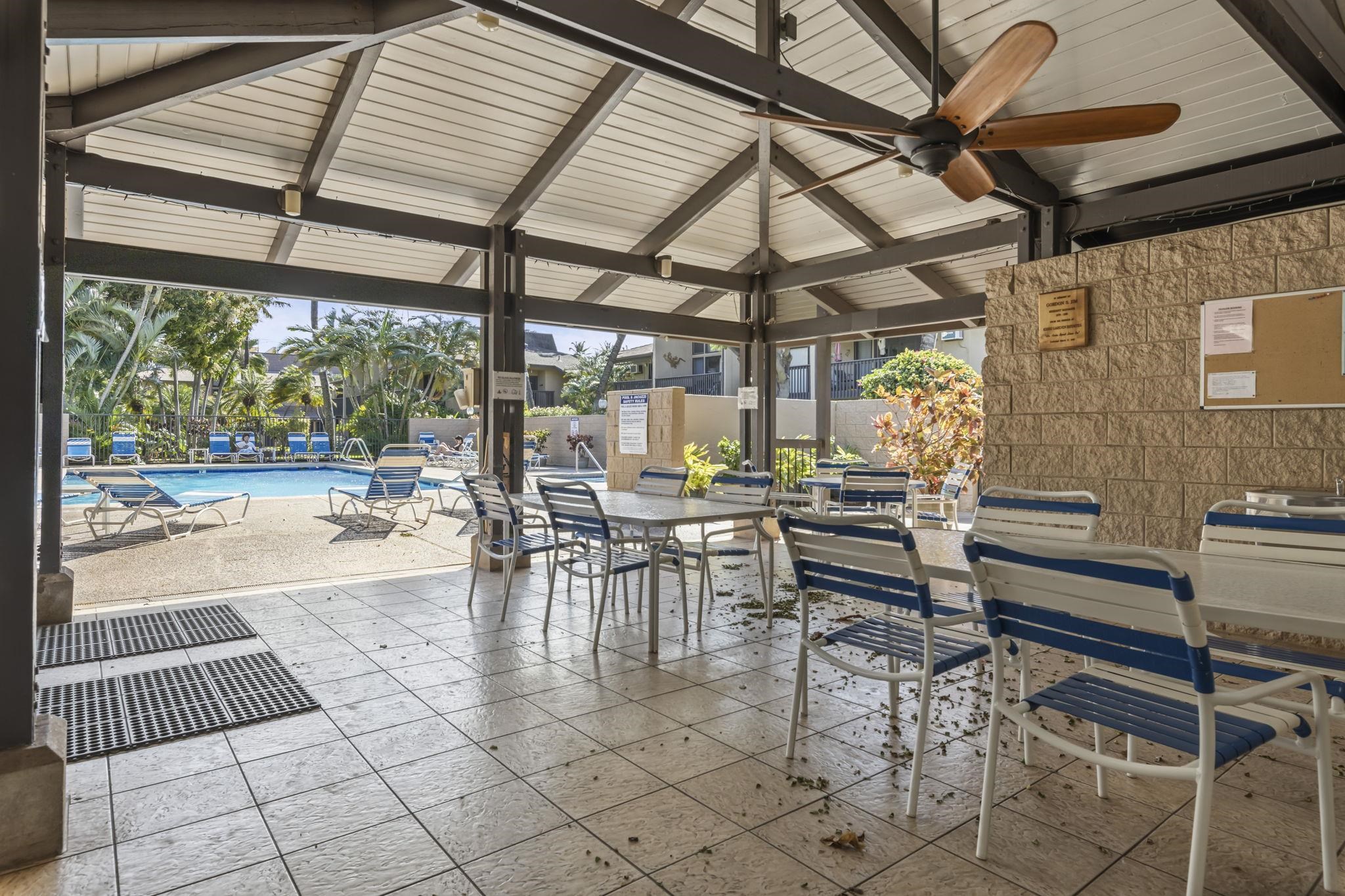 1299 Uluniu Road, Unit G202 Kihei, HI 96753 - Photo 35 of 46 a view of a patio with dining table and chairs