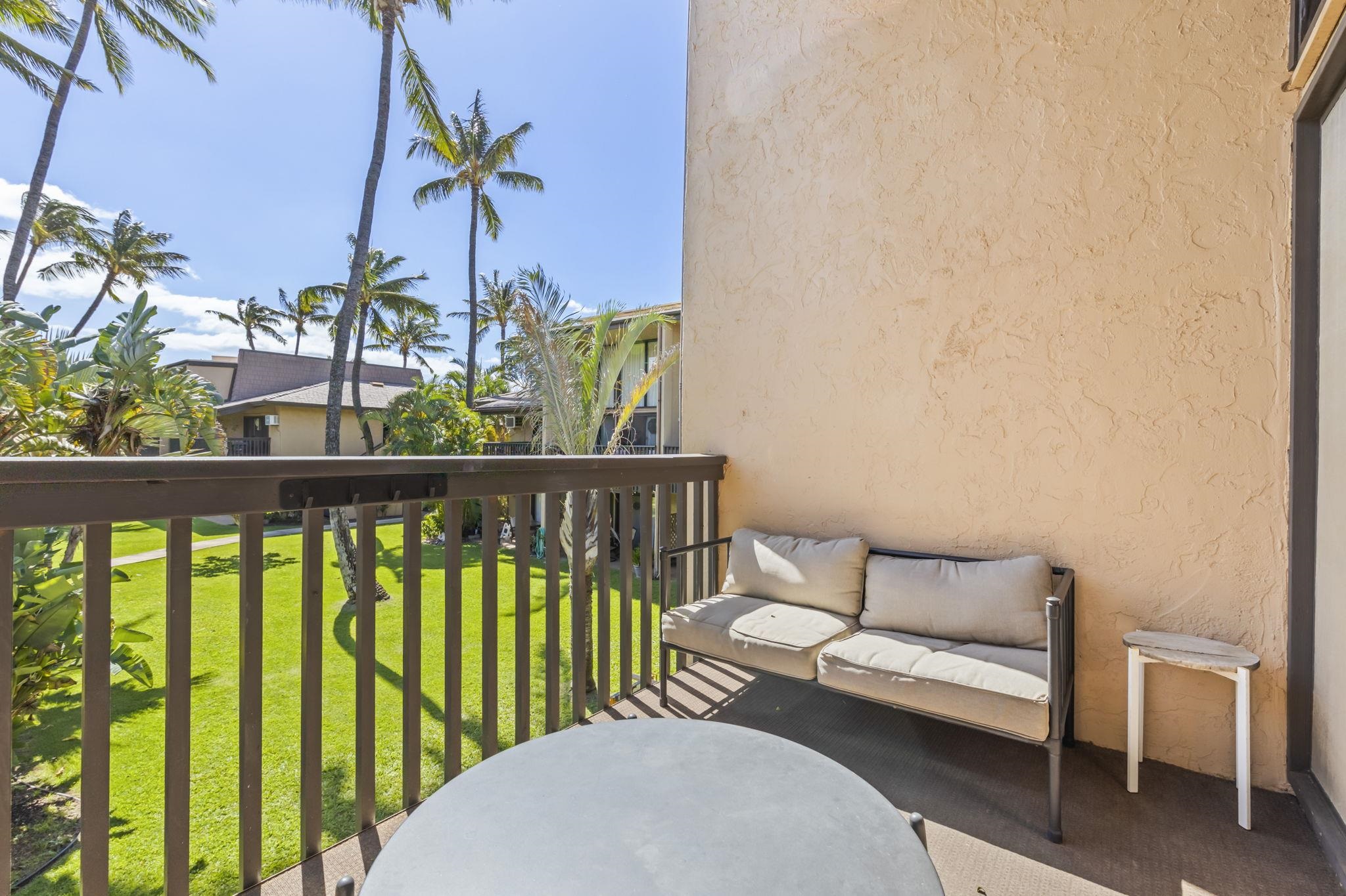 1299 Uluniu Road, Unit G202 Kihei, HI 96753 - Photo 6 of 46 a balcony with chairs and a potted plant
