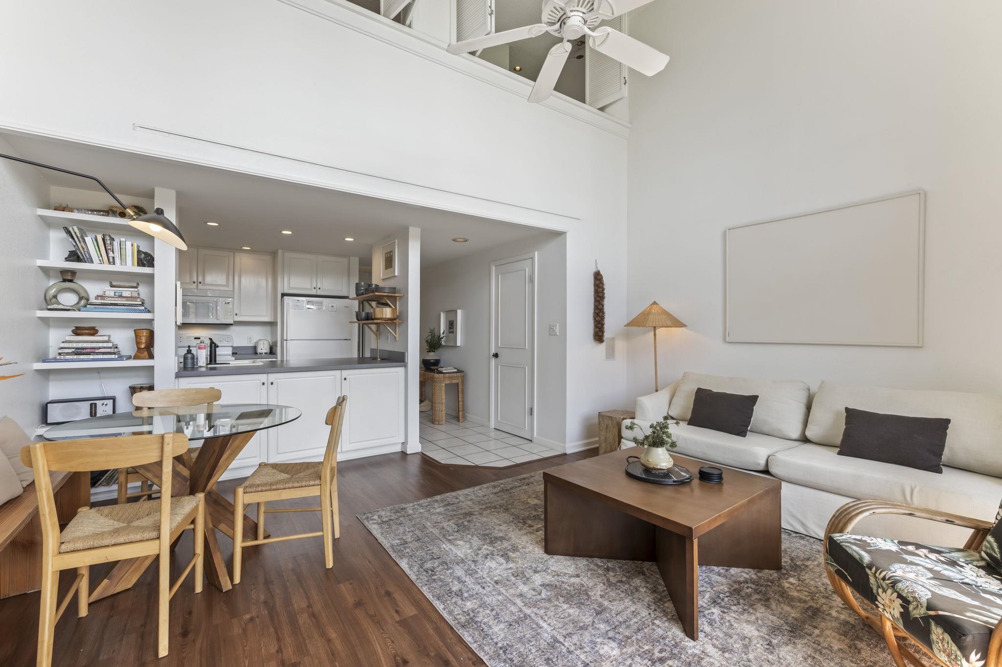 1299 Uluniu Road, Unit G202 Kihei, HI 96753 - Photo 8 of 46 a living room with furniture and a wooden floor