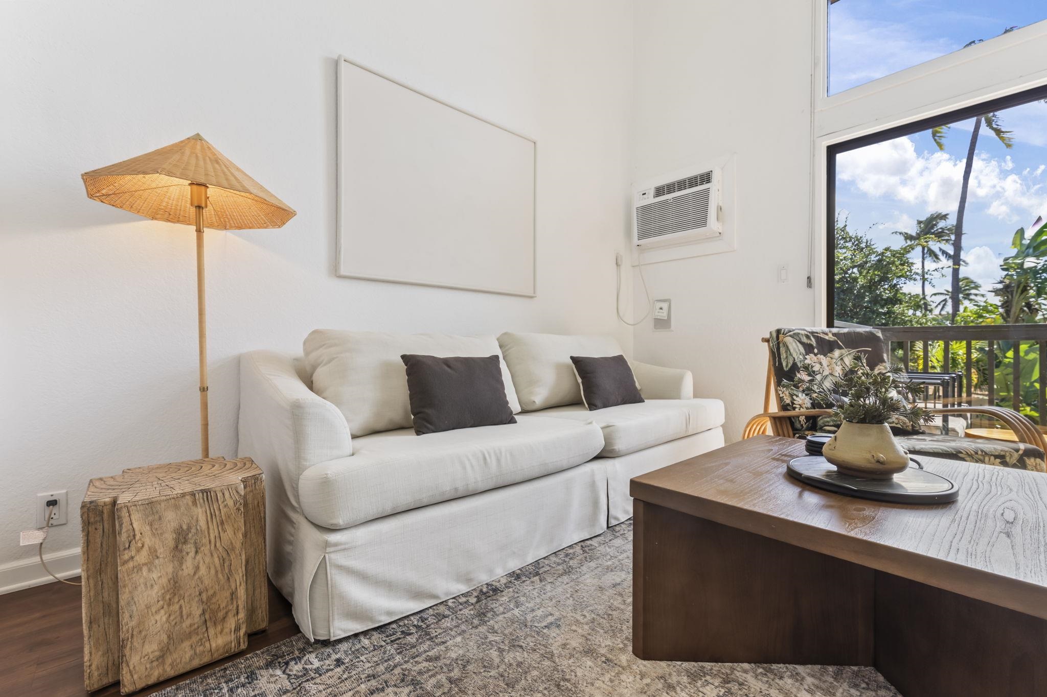 1299 Uluniu Road, Unit G202 Kihei, HI 96753 - Photo 10 of 46 a living room with furniture and a flat screen tv