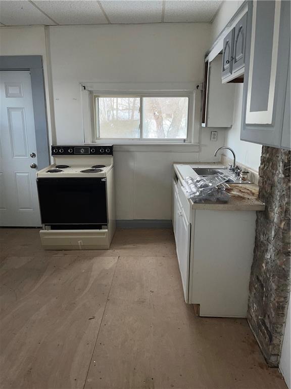 119 Heim Avenue Butler, PA 16001 - Photo 3 of 13 a kitchen with granite countertop a stove and a sink