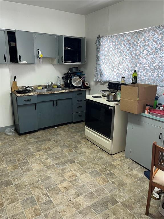 119 Heim Avenue Butler, PA 16001 - Photo 7 of 13 a kitchen with stainless steel appliances granite countertop a stove a sink and a refrigerator