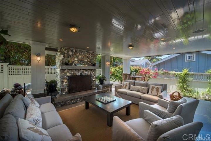 111 10th Street Del Mar, CA 92014 - Photo 13 of 23 a living room with furniture and a fireplace