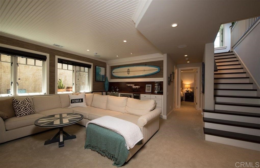 111 10th Street Del Mar, CA 92014 - Photo 14 of 23 a living room with furniture and a large window