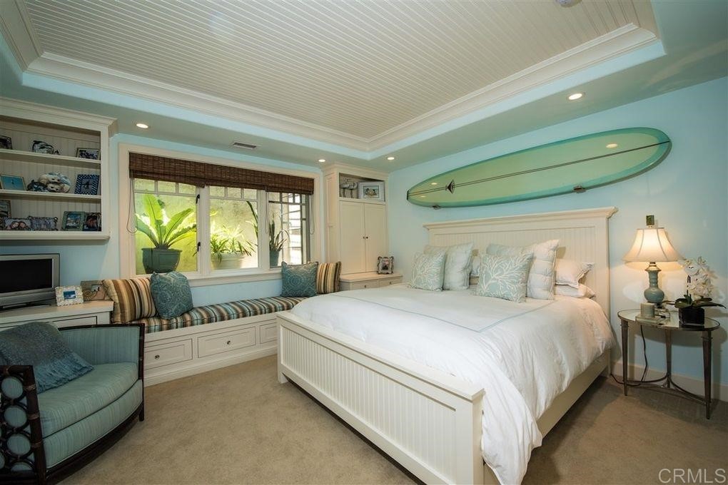 111 10th Street Del Mar, CA 92014 - Photo 17 of 23 a bedroom with a bed and a large window