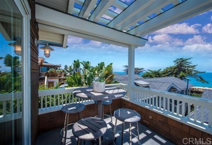 111 10th Street Del Mar, CA 92014 - Photo 19 of 23 a balcony view with chairs and wooden fence