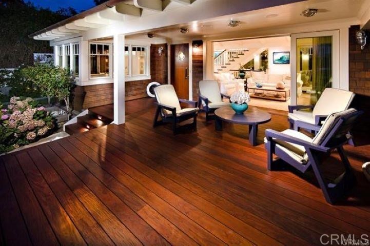 111 10th Street Del Mar, CA 92014 - Photo 3 of 23 a building outdoor space with patio furniture and wooden floor